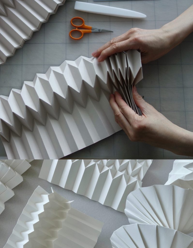 händer viker origami